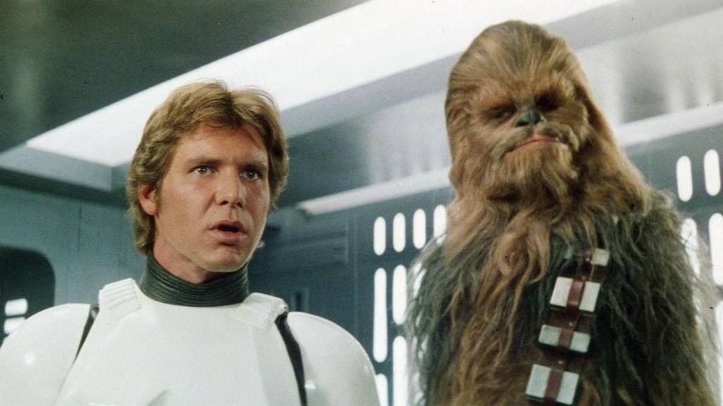 Harrison Ford and Peter Mayhew in Star Wars. George Lucas sold his Lucas film group to Disney at the end of 2012, receiving $2.2 billion in cash and 37.1 million Disney shares.