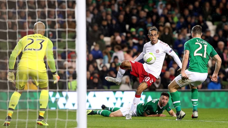 Kevin Long blocks a late Yussuf Poulsen shot. Photograph: Bryan Keane/Inpho