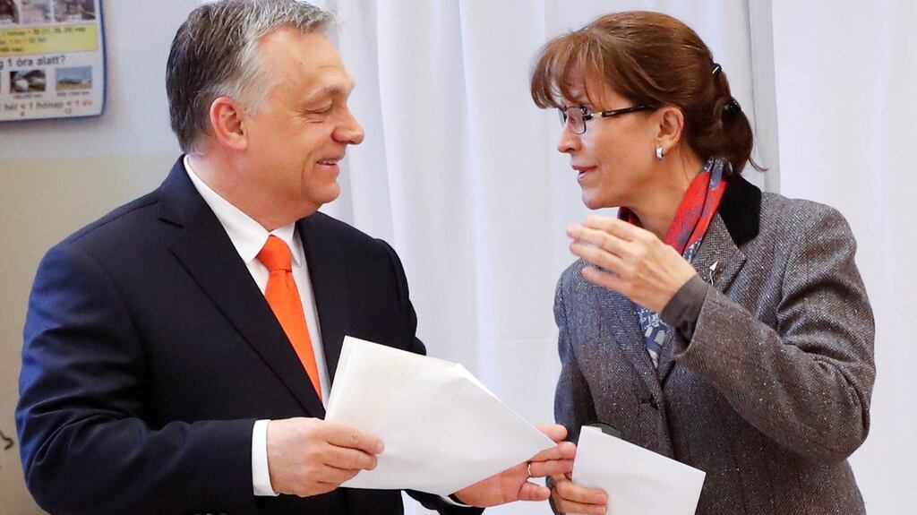 Hungarian prime minister Viktor Orban and his wife, Aniko Levai, leave a polling booth to cast their ballots. Photograph: REUTERS/Bernadett Szabo