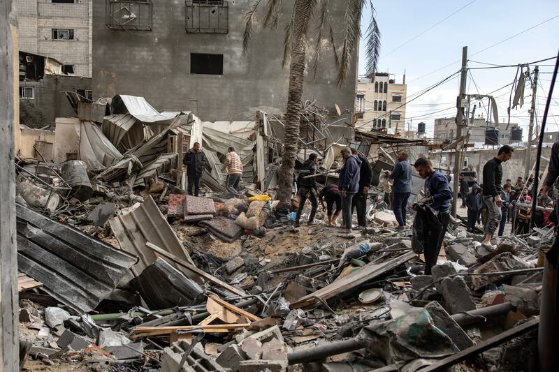 Palestinians search for missing people under the rubble of destroyed buildings following Israeli air strikes on Khan Younis, in the southern Gaza Strip. Photograph: Haitham Imad/EPA