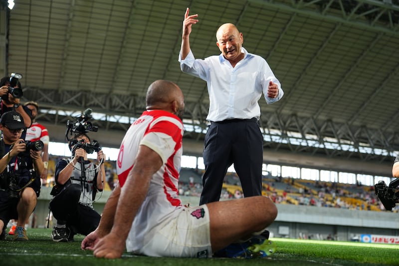 Eddie Jones talks to Michael Leitch after Japan's clash with Wales in Kobe in July. Photograph: Masterpress/Getty Images