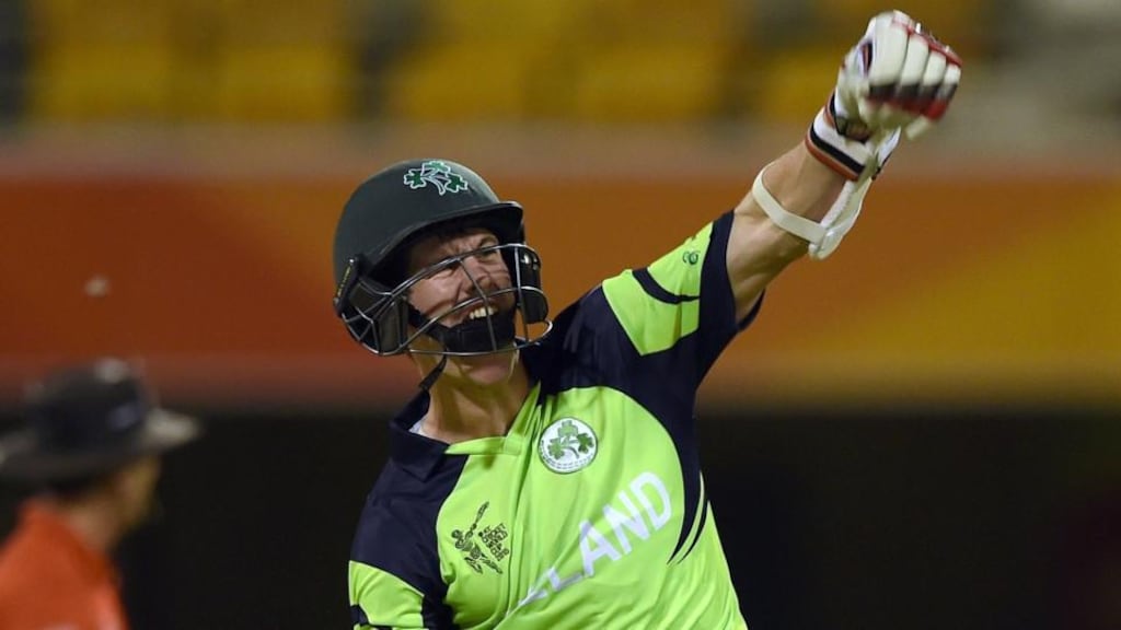 George Dockrell celebrates scoring the winning runs in Ireland’s two-wicket victory over the United Arab Emirates at the Gabba. Photograph: Indranil Mukherjee/AFP/Getty Images