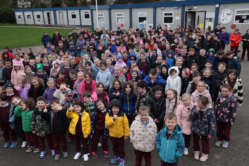 Pupils at Gaelscoil na Camóige in Clondalkin, Dublin, which has been obliged to use prefabs for 30 years. Photograph: Laura Hutton