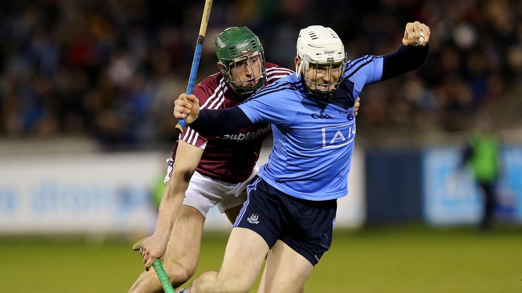 Dublin’s Liam Rushe holds off the challenge of Galway’s Niall Burke during the Allianz Hurling League Division 1A game at Parnell Park. Photograph: Ryan Byrne/Inpho