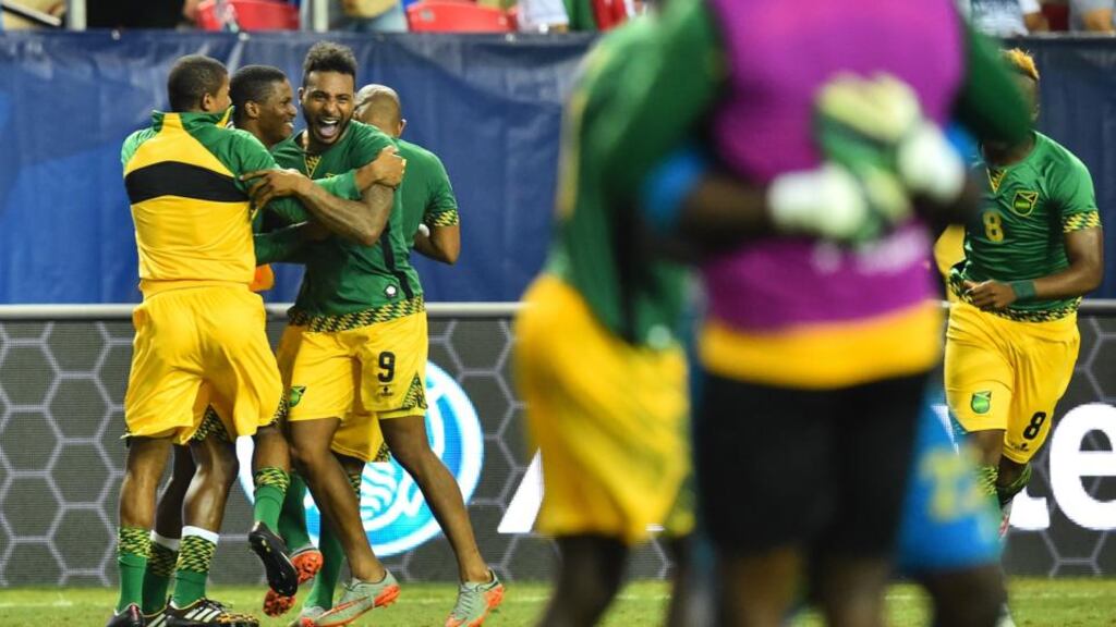 Jamaica’s Giles Barnes and teammates celebrate defeating the US 2-1 in a CONCACAF Gold Cup semifinal football match in Atlanta. Photograph: Getty Images