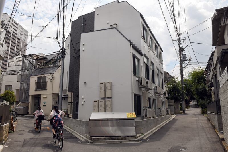 A building housing the tiny apartments in Tokyo. Photograph: Noriko Hayashi/The New York Times