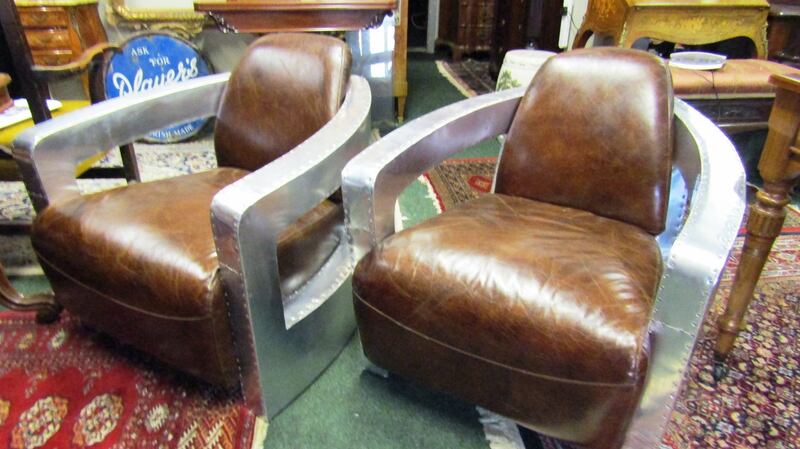 A pair of aluminium-framed leather chairs at Matthews auction rooms (€700-€1,200)