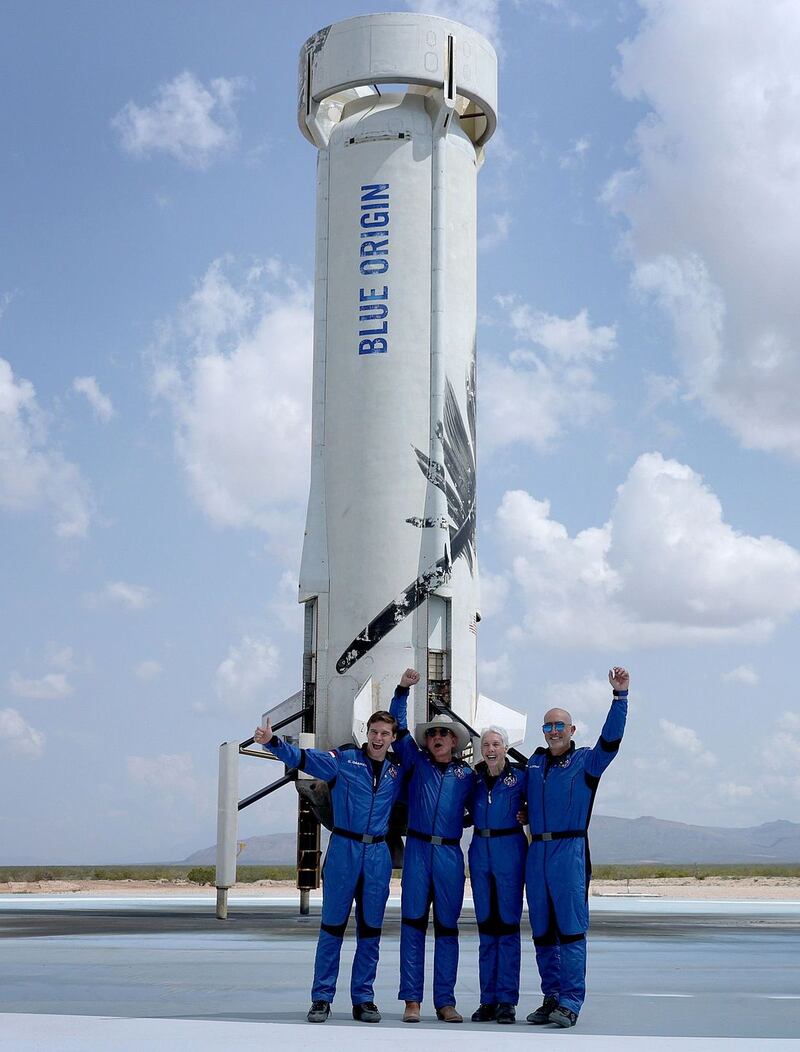 Jeff Bezos, in hat, poses with crew mates Oliver Damen, Wally Funk and Mark Bezos after Blue Origin’s inaugural flight to the edge of space. Photograph: Joe Raedle/Getty