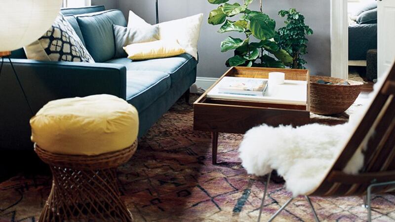 Layering rugs is a great way to conceal a not-so-good looking floor, as well as adding texture and colour