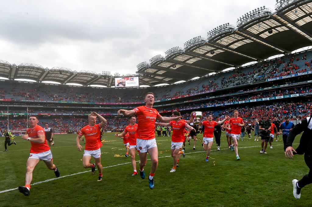 Armagh players celebrate with the Sam Maguire Cup in Croke Park after their win over Galway. Photograph: Bryan Keane/Inpho