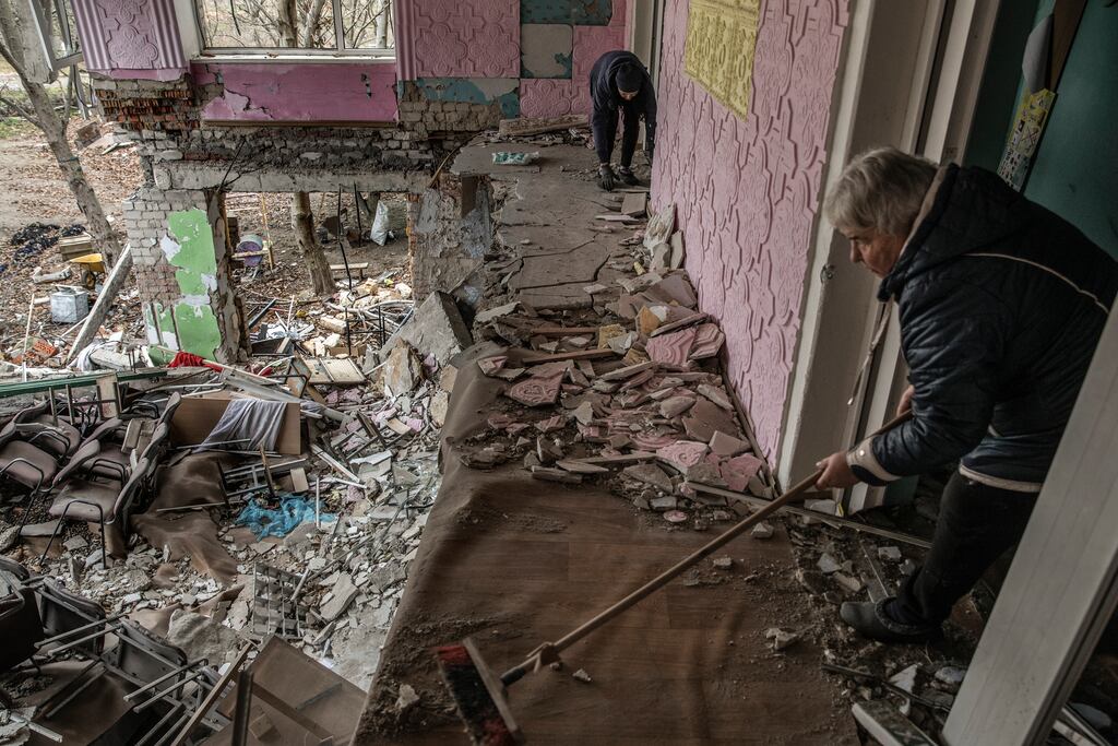 Teachers work to clean up a battle-damaged school in the southern Mykolaiv region, Ukraine. Photograph: Finbarr O’Reilly/The New York Times