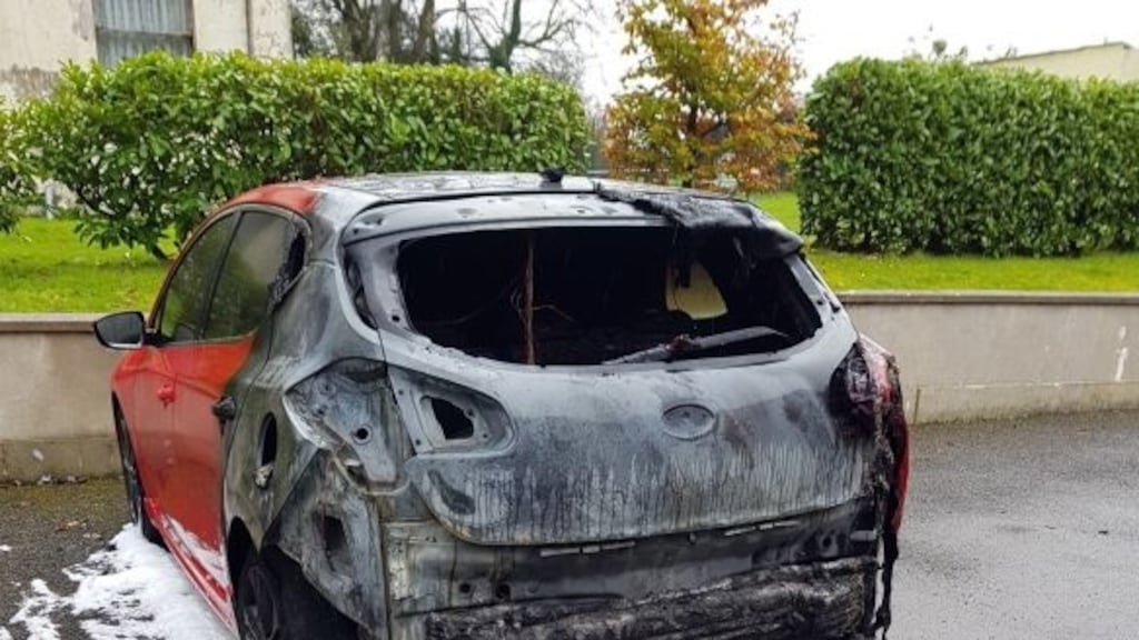 A  car belonging to the daughter of QIH’s Tony Lunney after an arson attack last October.