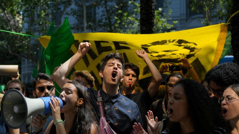 Climate activists in Barcelona protesting over the fires in the Amazon. Photograph: Lluis Gene/AFP/Getty Images