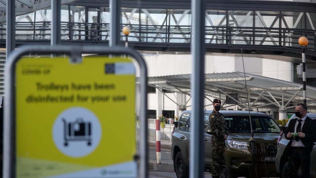 Defence Forces personnel at Dublin Airport await flights in order to escort passengers to their mandatory hotel quarantine. Photograph: Colin Keegan/Collins