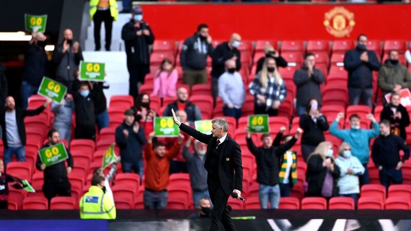 Manchester United manager Ole Gunnar Solskjaer waves to supporters at Old Trafford. Photograph: Laurence Griffiths/PA