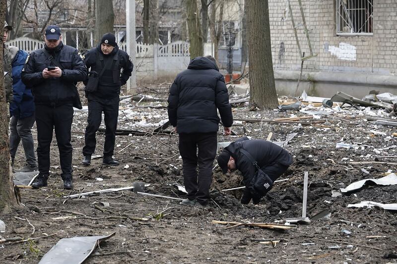 Police investigate the site of shelling near residential buildings in Kharkiv, Ukraine, on Wednesday. Photograph: Sergey Kozlov/EPA