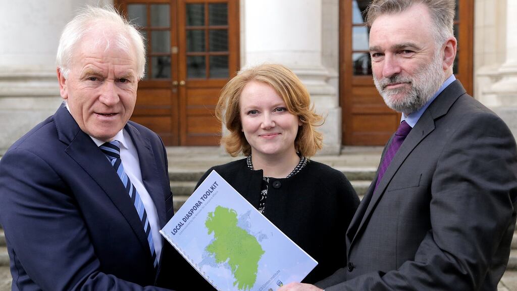 Minister of State for the Diaspora Jimmy Deenihan with Madeleine Lyes and Liam Kennedy of the UCD Clinton Institute, authors of the Diaspora Toolkit document.