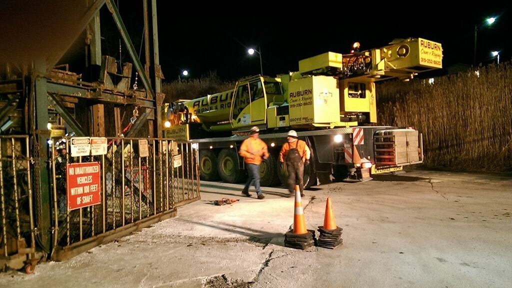 A crane arrives at the Cargill salt mine in Lansing, New York, where 17 miners were trapped in an elevator shaft. Photograph: Ithaca Fire Department/Handout via Reuters.