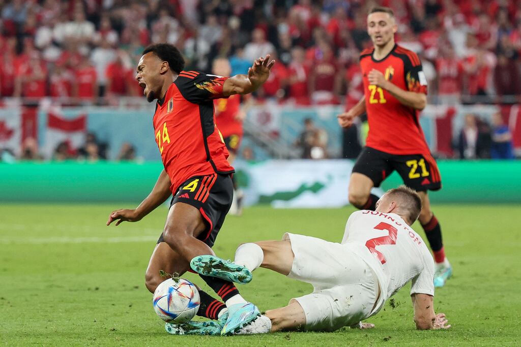 Canada's defende Alistair Johnston (right) fights for the ball with Belgium's forward Lois Openda. Photograph: Jack Guez/AFP via Getty Images