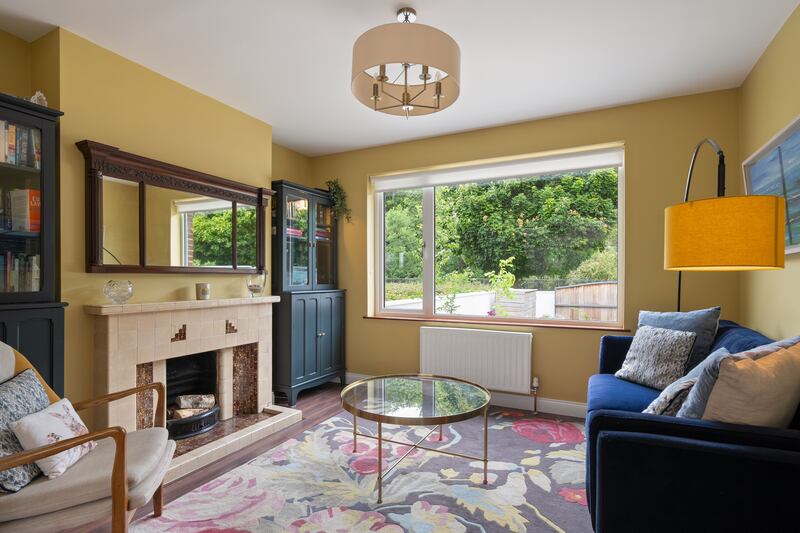 A livingroom overlooks the front garden