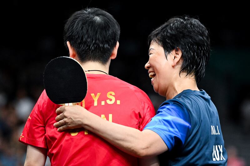 Luxembourg's Xia Lian Ni (right) congratulates China's Sun Yingsha after their women's table tennis singles round of 32 game. Photograph: Jung Yeon-Je/AFP via Getty