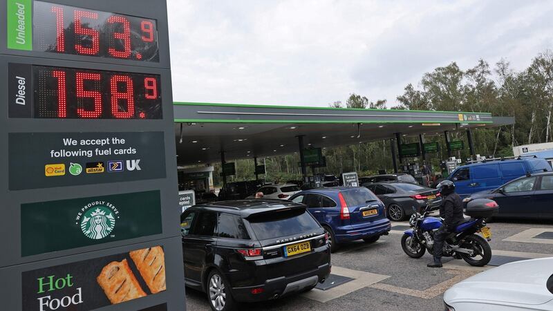 Drivers queue for petrol and diesel fuel at a filling station off of the M3 motorway near Fleet, west of London, on Sunday. Photograph: Getty Images