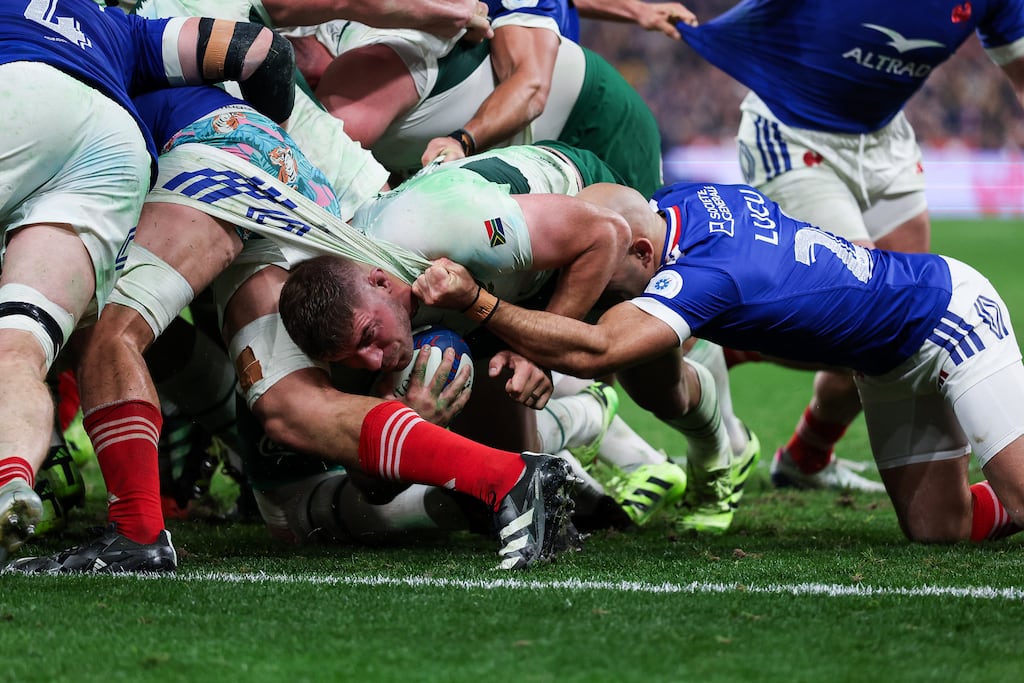 French scrum-half Maxime Lucu pulls the shorts of a teammate during Saturday's Test against South Africa in Paris. Photograph: Franck Fife/Getty