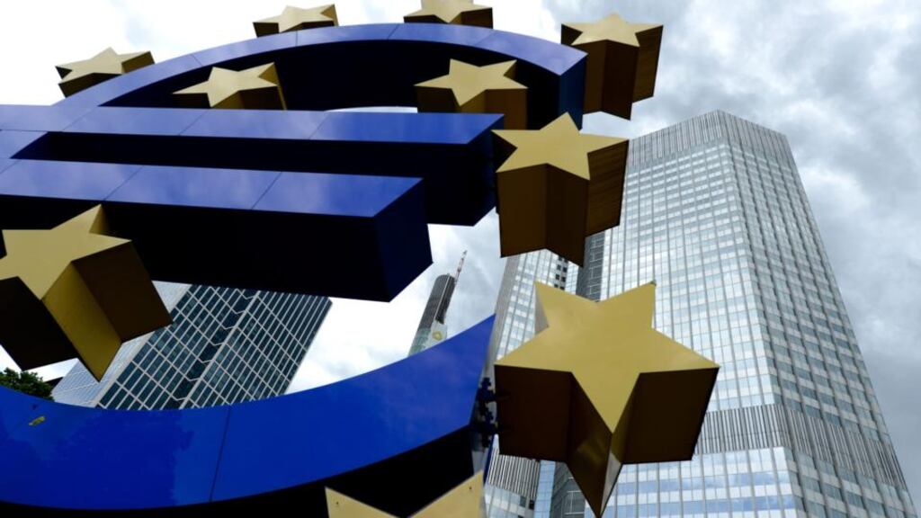 The euro sculpture outside of the European Central Bank building in Frankfurt. Photograph: Arne Dedert/EPA