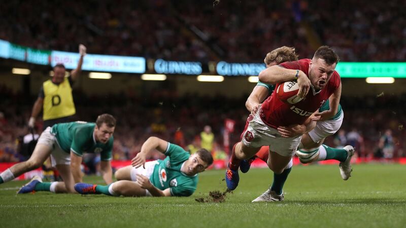 Wales wing Owen Lane dives over to score their first try. Photograph: Stu Forster/Getty Images