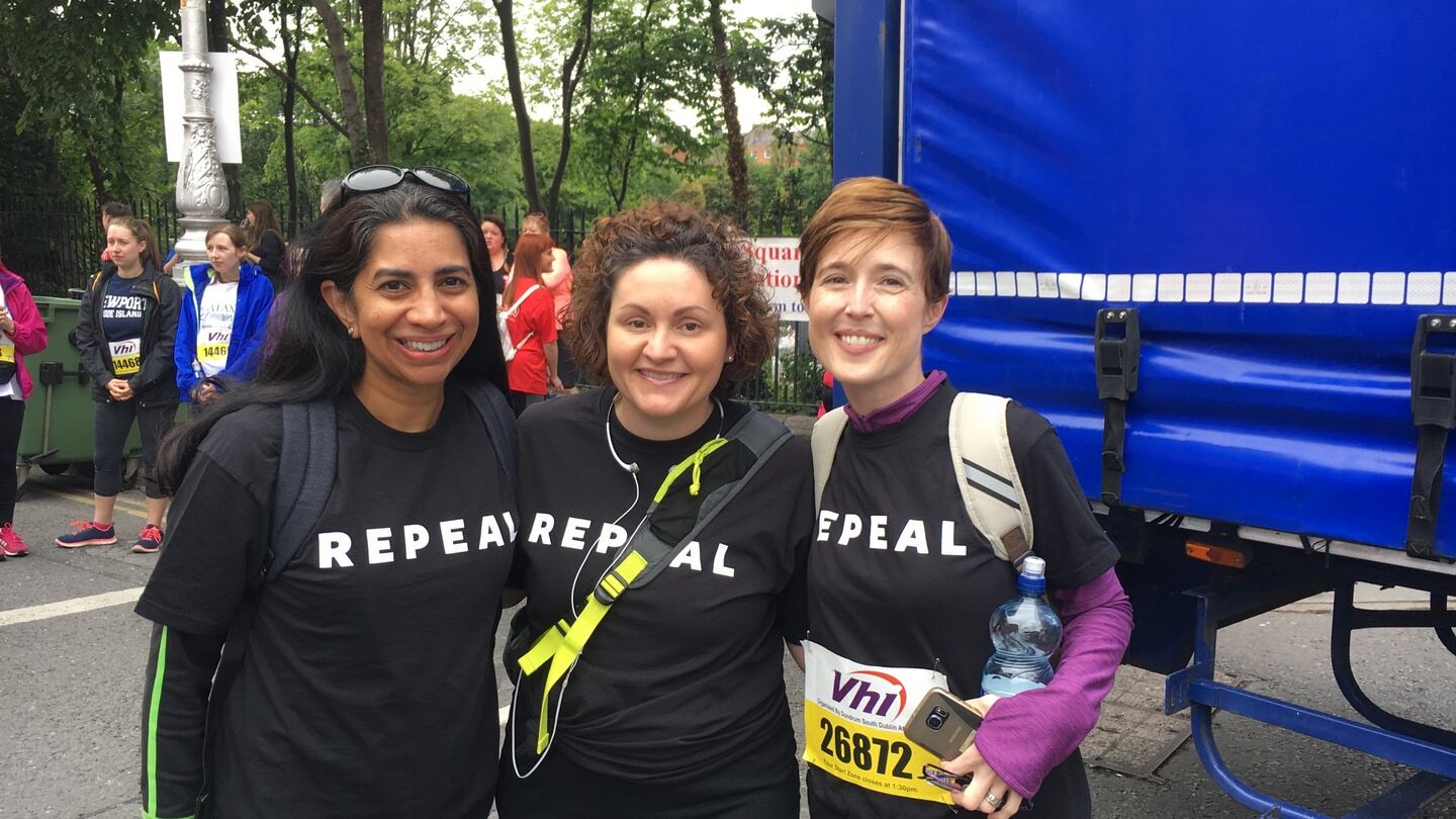 Pamela Iyer, Kate Roandazzo and Amelia Sorohan prepare to run the mini-marathon dressed in their black and white repeal T-shirts. Photograph: Sorcha Pollak