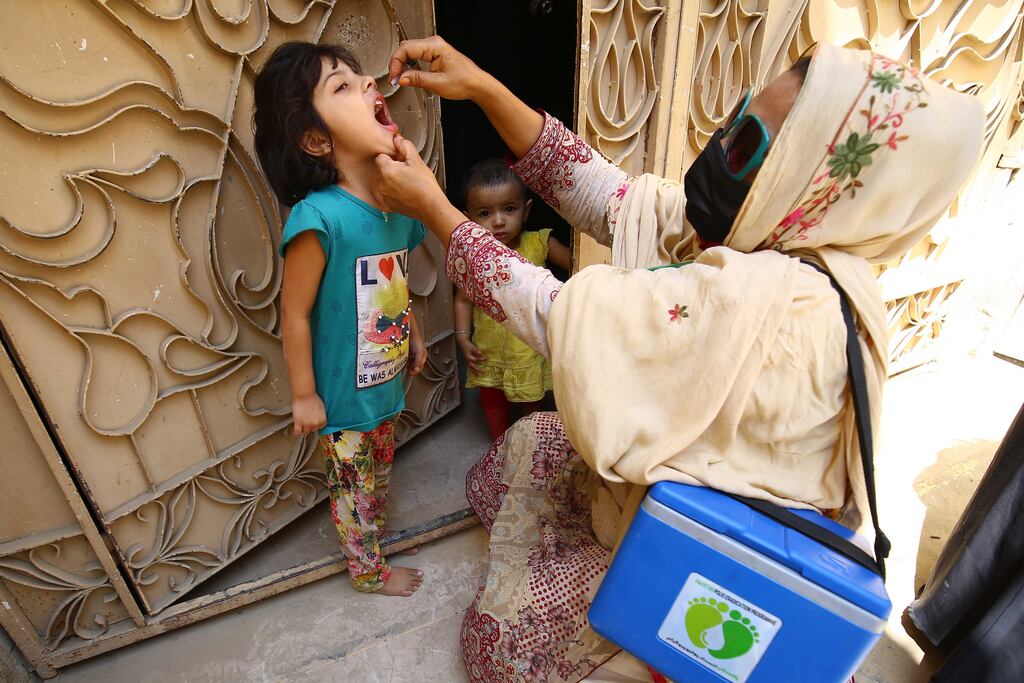 A polio vaccine is administered to a child in Karachi, Pakistan. Photograph: Shahzaib Akber/EPA