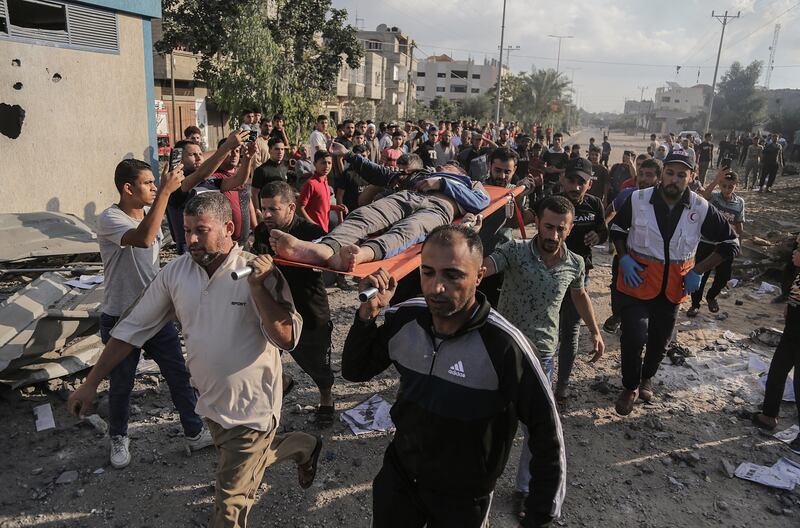 Palestinians search for bodies and survivors in the rubble of a residential building levelled in an Israeli air strike, in Khan Younis refugee camp in the southern Gaza Strip, on Monday. Photograph: Haitham Imad/EPA