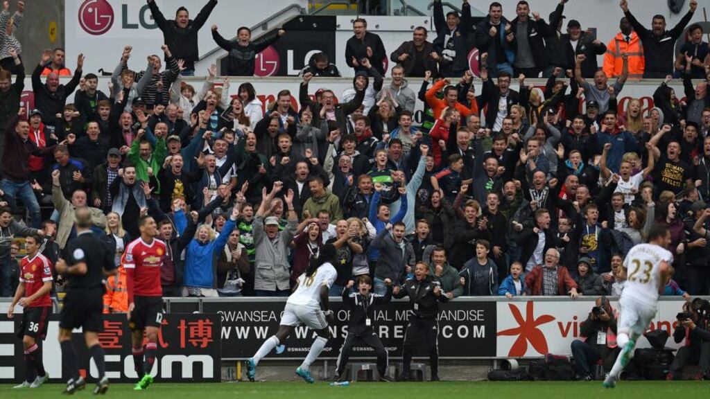 Swansea City’s Bafetimbi Gomis celebrates after scoring their second goal during the English Premier League match between Swansea City and Manchester United at The Liberty Stadium in Swansea. Photo: Paul Ellis/AP