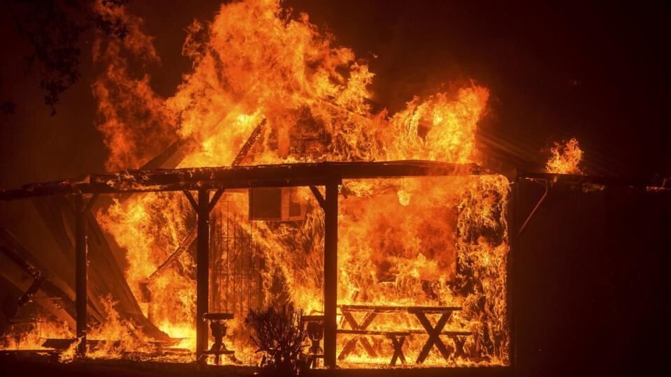 A house burns as the Butte fire rages through Mountain Ranch, California. Photograph: Reuters