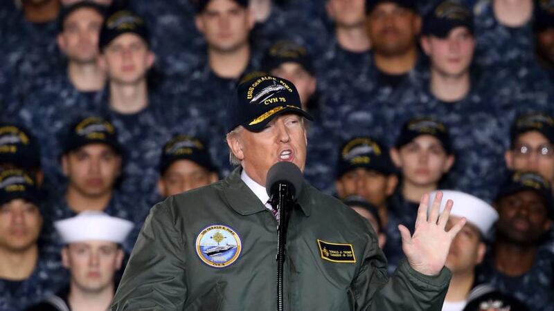Man in uniform: Donald Trump speaks to sailors aboard a US aircraft carrier. Photograph: Mark Wilson/Getty