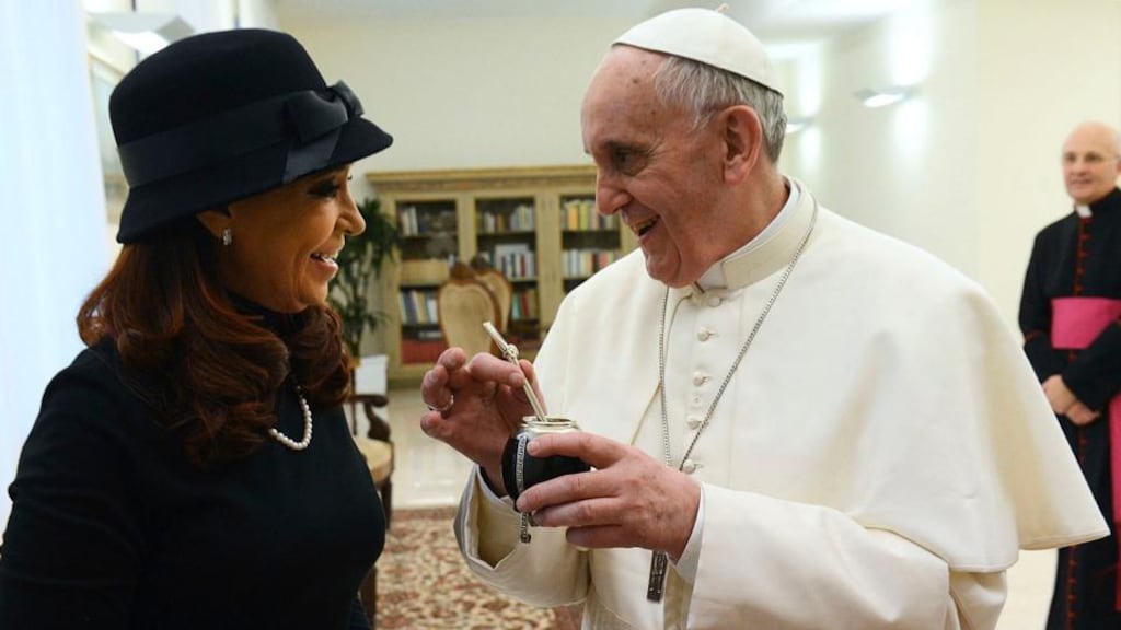 Pope Francis holds a traditional calabash gourd used to drink Mate, which was given to him as a present from President Cristina Kirchner yesterday. Photograph: Argentine Presidency via New York Times