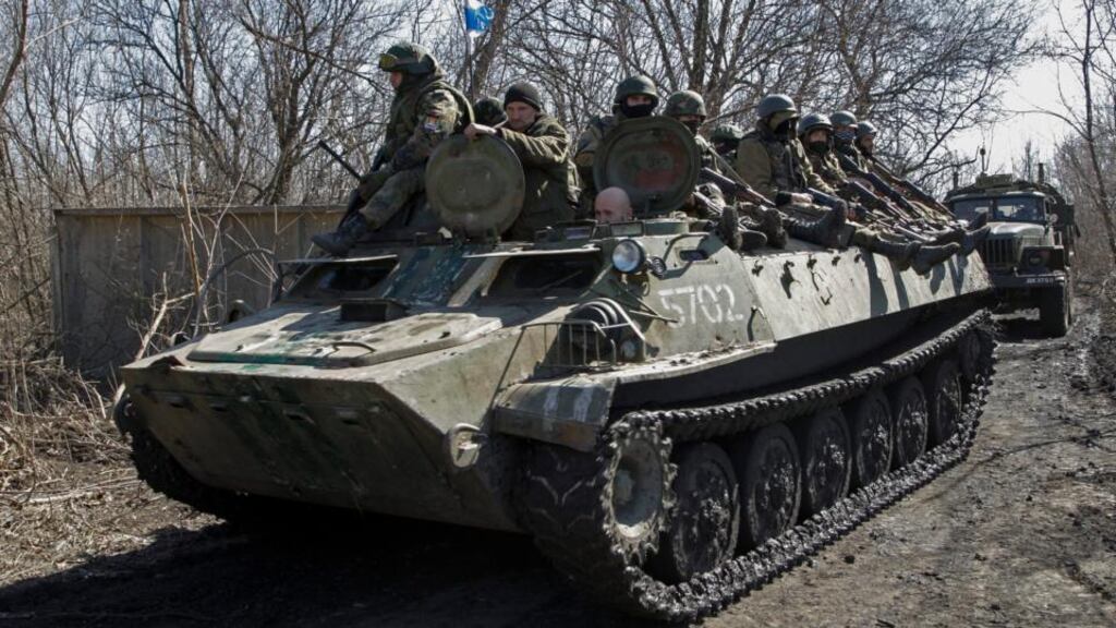 Pro-Russian rebels drive on an armored military vehicle near city of Donetsk, Ukraine. Photograph: Alexander Ermochenko/EPA