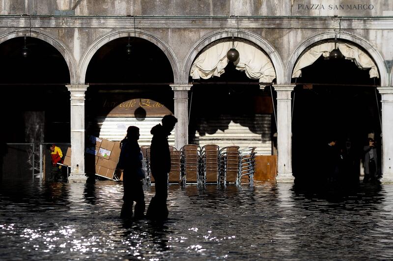 People walk across the flooded St Mark’s Square in Venice on Thursday. Photograph: Filippo Monteforte/AFP via Getty