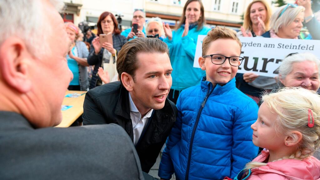 ÖVP chief Sebastian Kurz presses the flesh on the campaign trail in Baden. Photograph: Getty
