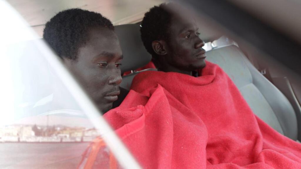 Two of nine sub-Saharan migrants who were rescued while trying to reach Tarifa’s coast in Cadiz, Andalusia, Spain, this week. Many migrants are encouraged to undertake the sea crossing by traffickers, who charge extortionate sums. Photograph: EPA