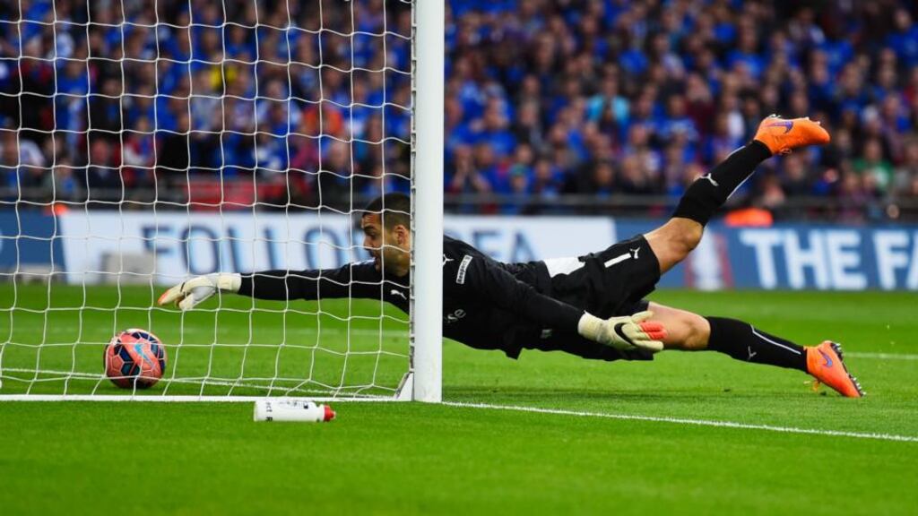 Reading goalkeeper Adam Federici stretches for the ball but fails to stop a shot by Arsenal’s Alexis Sanchez in extra-time during the FA Cup semi-final at Wembley. Photograph: Mike Hewitt/Getty Images