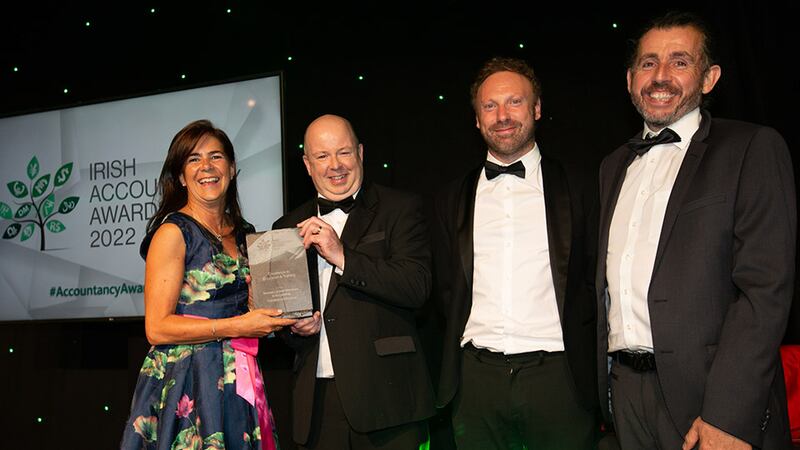 Anne Keogh, awards judging co-ordinator, presents the Excellence in Education and Training award to the TUS Midlands (Athlone) team.