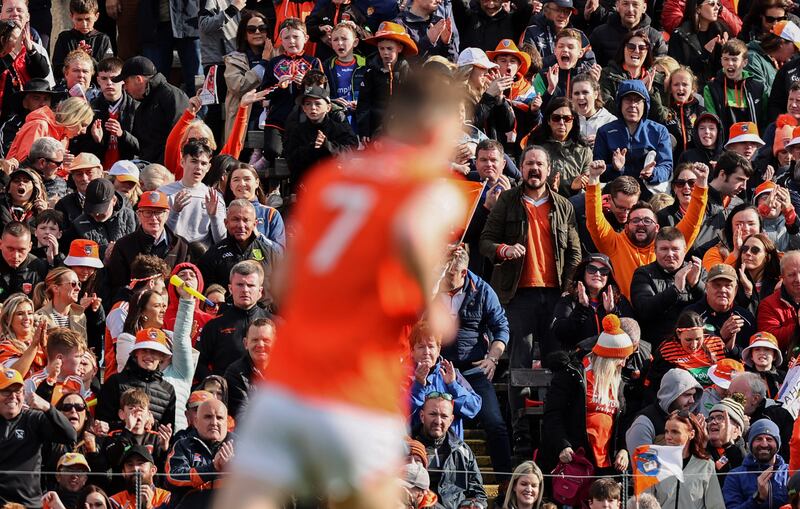 Armagh fans celebrate after Jarlath Óg Burns scores a point in the Ulster final. Photograph: Tom Maher/Inpho