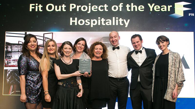 Tomás Mac Eoin, MD, McKeon Group presents the Fit Out Project of the Year - Hospitality award to the NODA Architects team