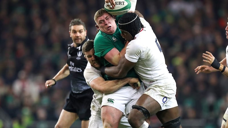 Tadhg Furlong’s progress is halted by the combined tackles from England’s Mark Wilson and Maro Itoje during the Six Nations clash at the Aviva Stadium. Photograph: Billy Stickland/Inpho