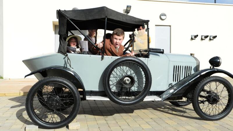 James Archbold from Tallaght with Ronan and Neala O Morain from Dalkey in one of the Overend vintage cars at Airfield which reopens from today. Photograph: Cyril Byrne/The Irish Times