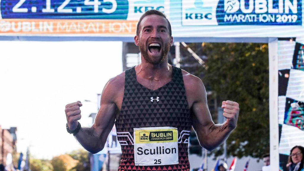 Stephen Scullion celebrates as he crosses the finish line at the 2019 Dublin Marathon. Photograph: Bryan Keane/Inpho