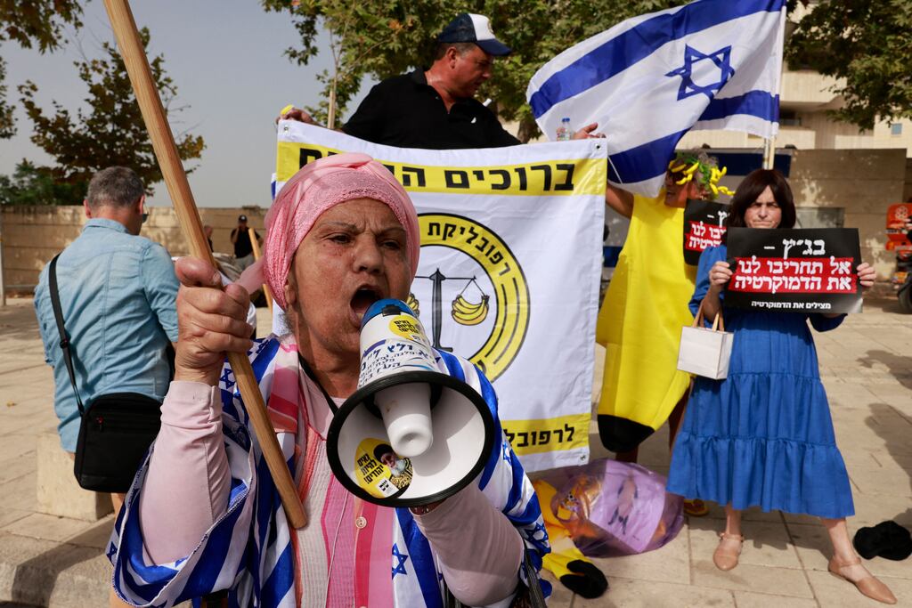 Demostraters rally in support of the Israeli government's judicial overhaul plan in front of the supreme court in Jerusalem on Tuesday. The court is hearing petitions to strike down a key plank of the hard-right government's controversial judicial overhaul that has triggered mass protests. Photograph: Menahem Kahana/AFP via Getty Images