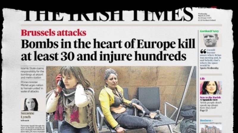 The front page of The Irish Times on March 23rd, 2016, featuring the photograph of Nidhi Chaphekar in the immediate aftermath of the Zaventem airport attack the previous day.