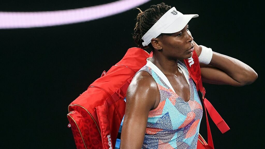 Venus Williams of the USA departs after being defeated by Belinda Bencic of Switzerland in round one of the Australian Open tennis tournament in Melbourne. Photograph: PA